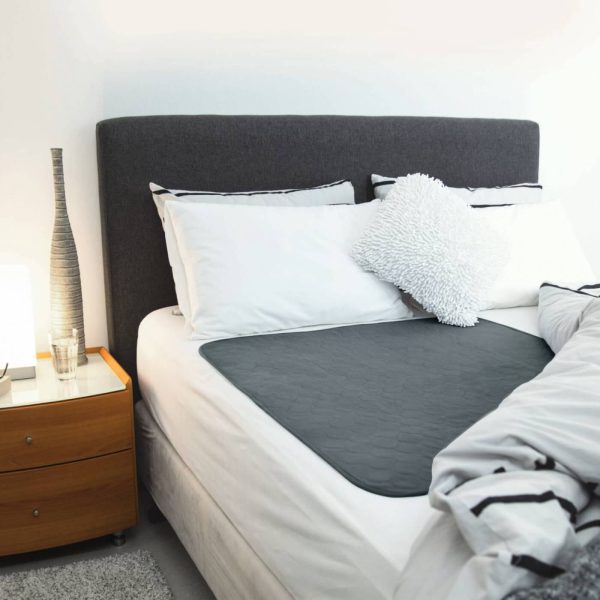 Grey Bed Pad on Bed