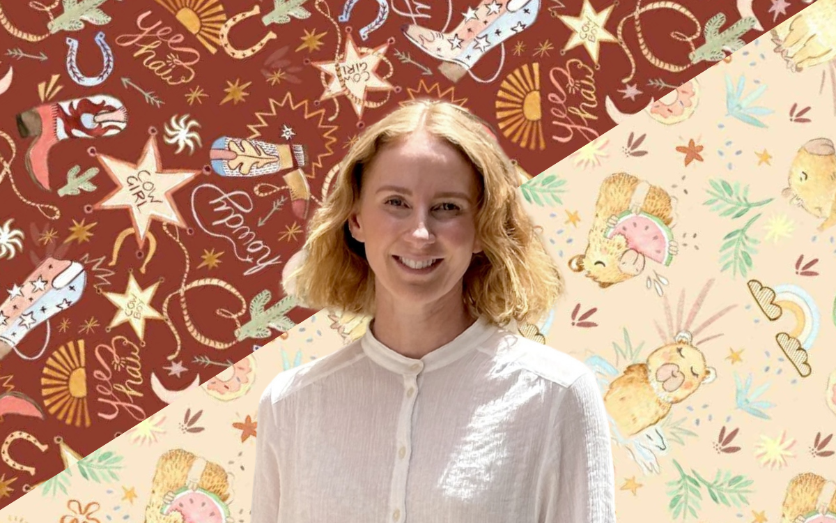 Picture of Leigh Coleman with the new prints as the background